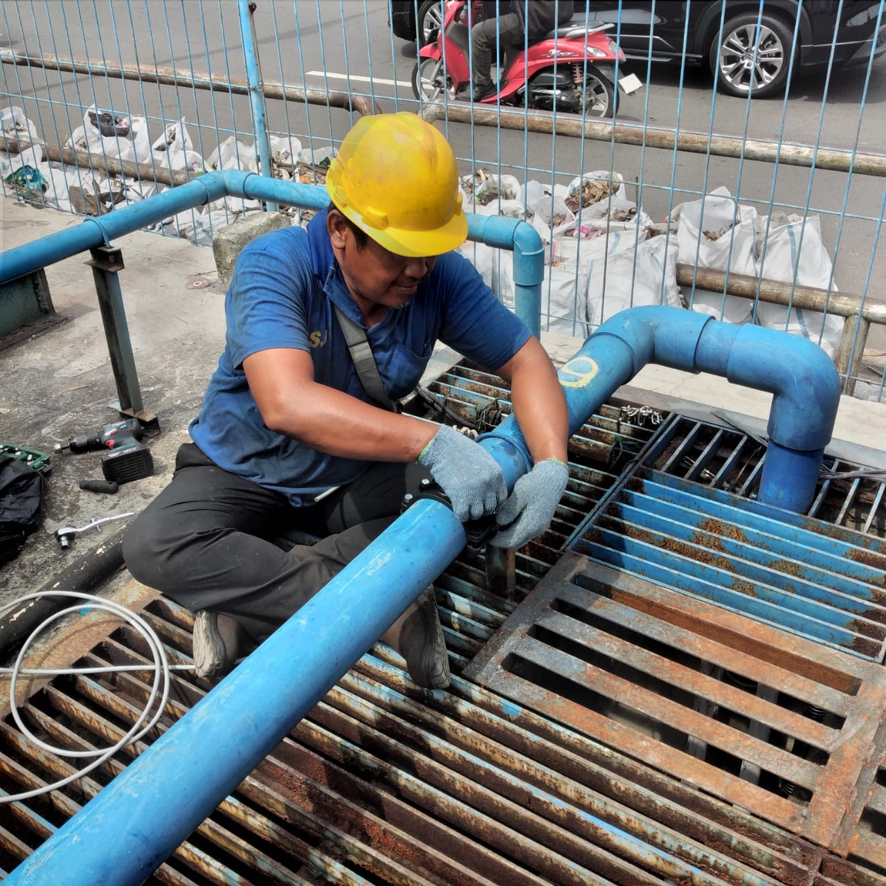 Blue pipe installation at pump area